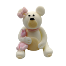 White teddy bear with a pink bow