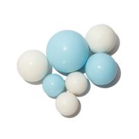 Creamy-blue chocolate balls of a mix of sizes