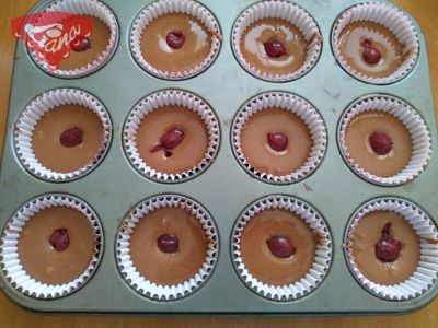 Gluten-free and dairy-free cupcakes with cherry and raspberry whipped cream