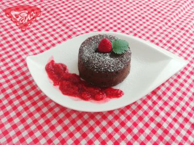 Gluten-free chocolate souffle with raspberry sauce