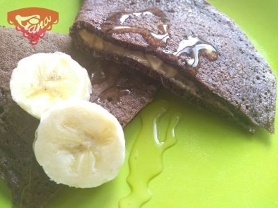 Gluten-free chocolate pancakes with peanut butter and bananas