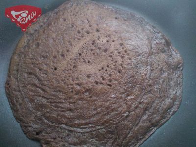 Gluten-free chocolate pancakes with peanut butter and bananas