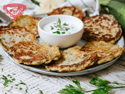 Gluten-free zucchini pancakes with yogurt-herb dip