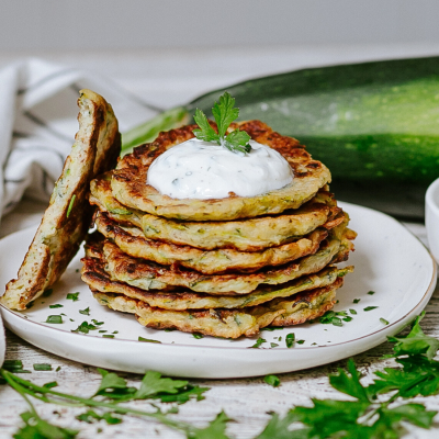 Gluten-free zucchini pancakes with yogurt-herb dip