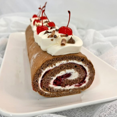 Gluten-free gingerbread Schwarzwald roulade with sour cherries