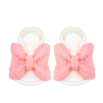 Weiße Schuhe mit rosa Schleife