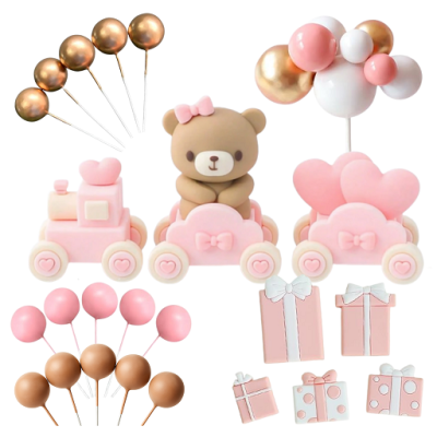 Miś, pociąg, prezenty i kulki z różowego złota