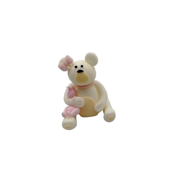 White teddy bear with a pink bow