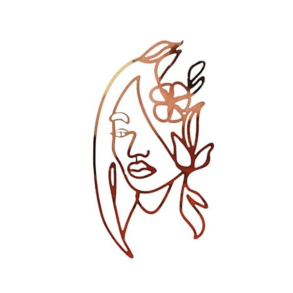 Gold woman&#39;s face cut into the side of an acrylic cake