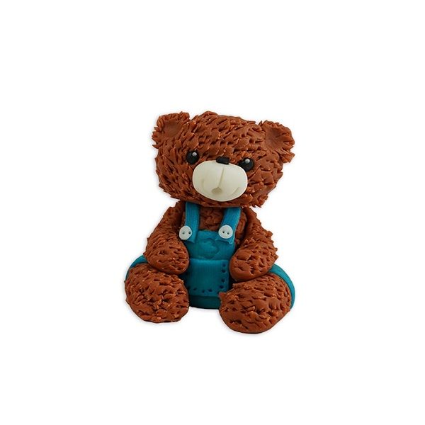 Brown teddy bear with blue pants