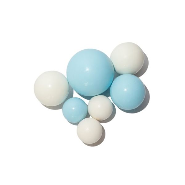 Creamy-blue chocolate balls of a mix of sizes