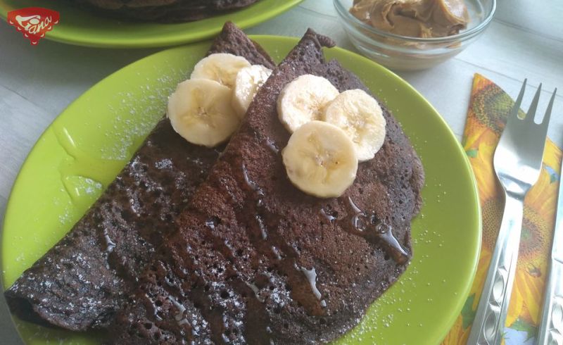 Gluten-free chocolate pancakes with peanut butter and bananas