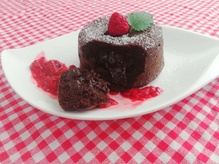 Gluten-free chocolate souffle with raspberry sauce