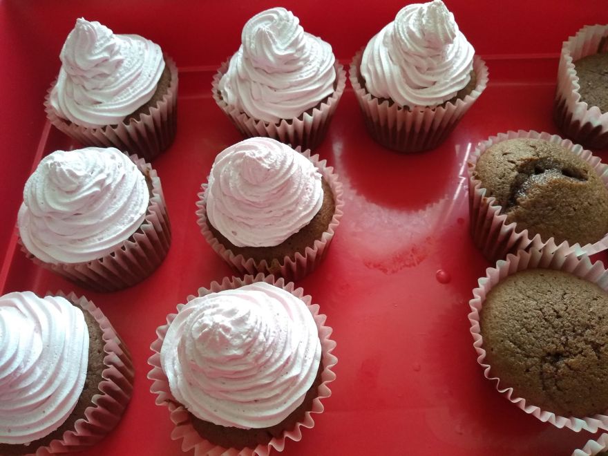 Gluten-free and dairy-free cupcakes with cherry and raspberry whipped cream