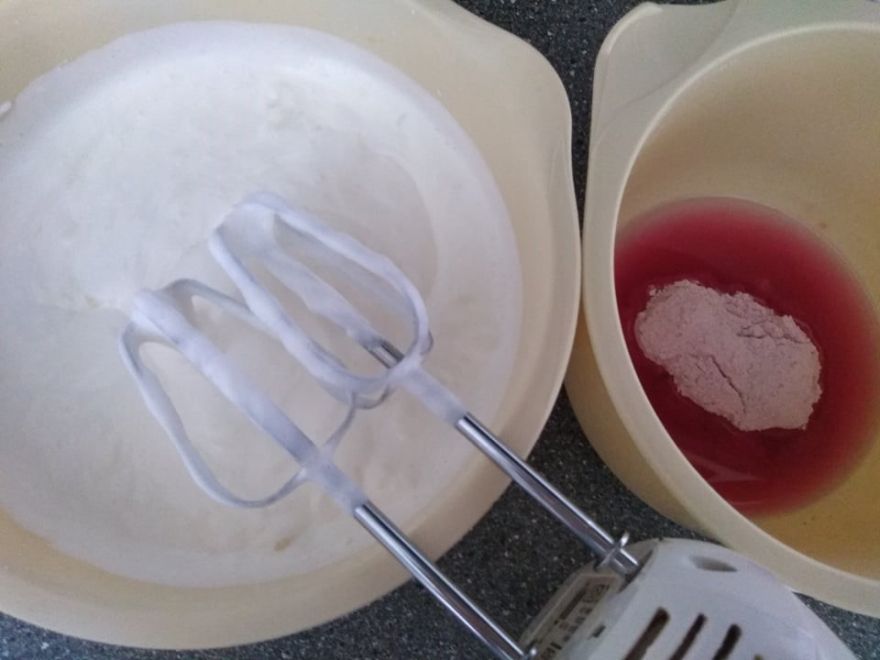 Gluten-free and dairy-free cupcakes with cherry and raspberry whipped cream